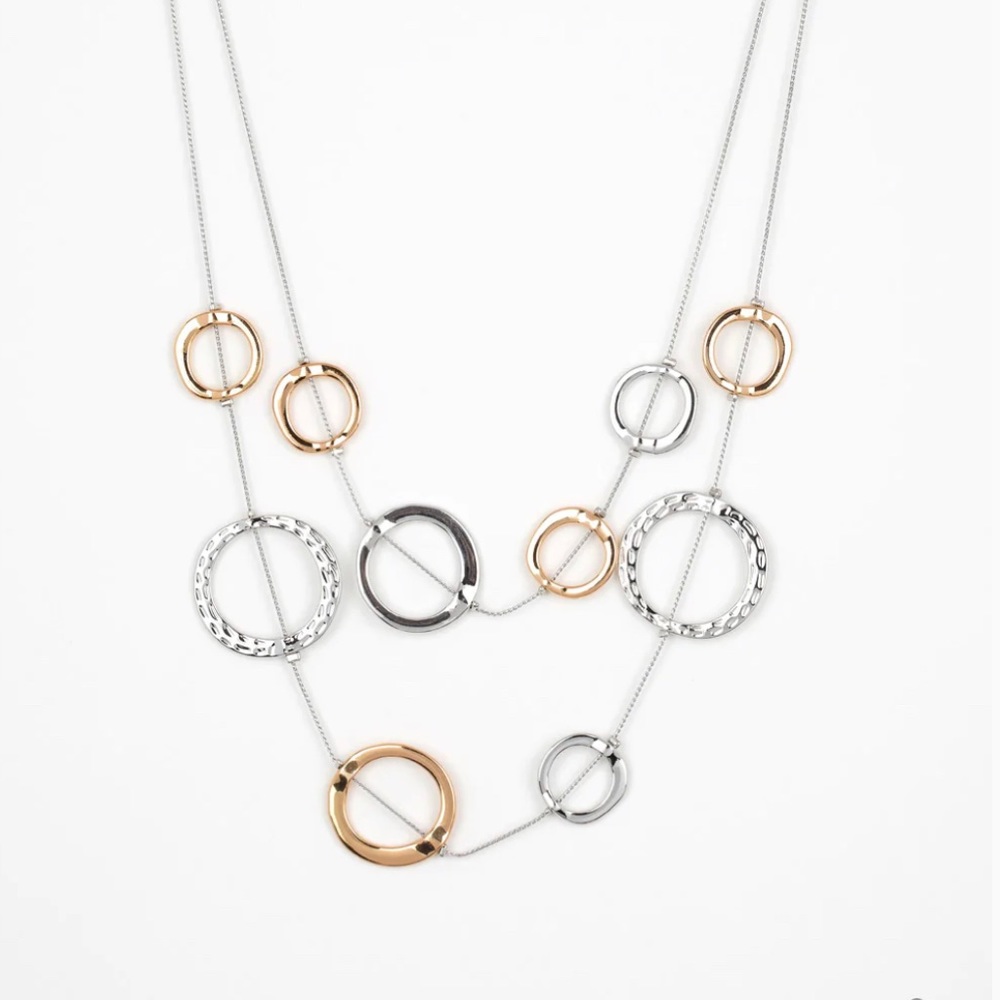 Ageless Aesthetics Silver Necklace by Paparazzi with matching earrings.